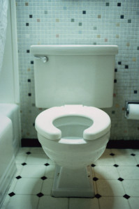 ca. 2002 --- Motel Room Toilet --- Image by © Royalty-Free/Corbis